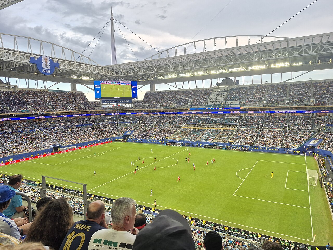 Cabo Verde and Uruguay playing at the 2026 World Cup in Miami, with the stadium scoreboard showing Uruguay 2, Cabo Verde 1 before the equalizer.