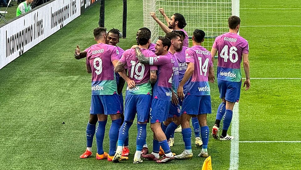 AC Milan players celebrate during an Italian league match in 2024.